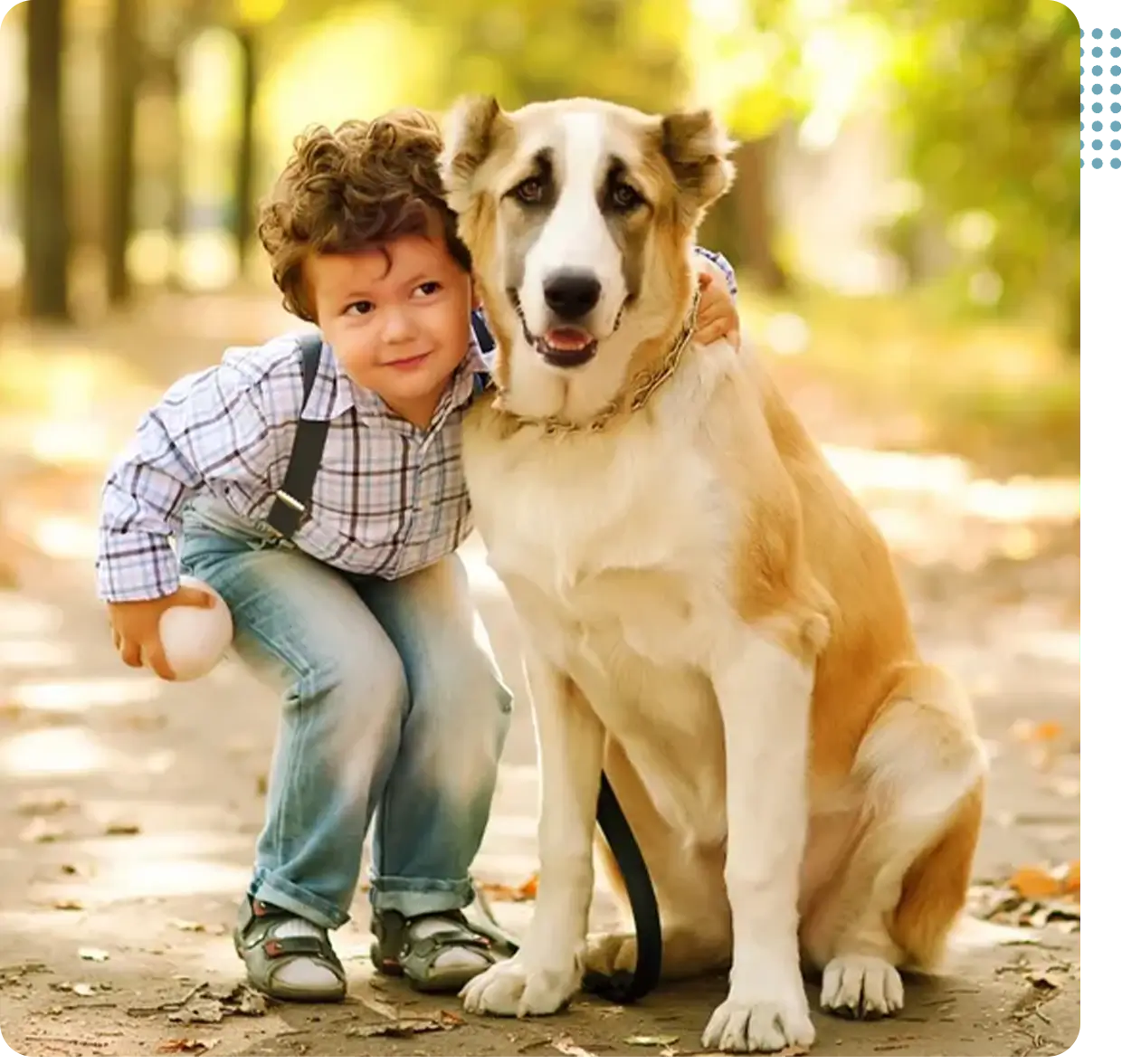 Young boy hugging large friendly dog