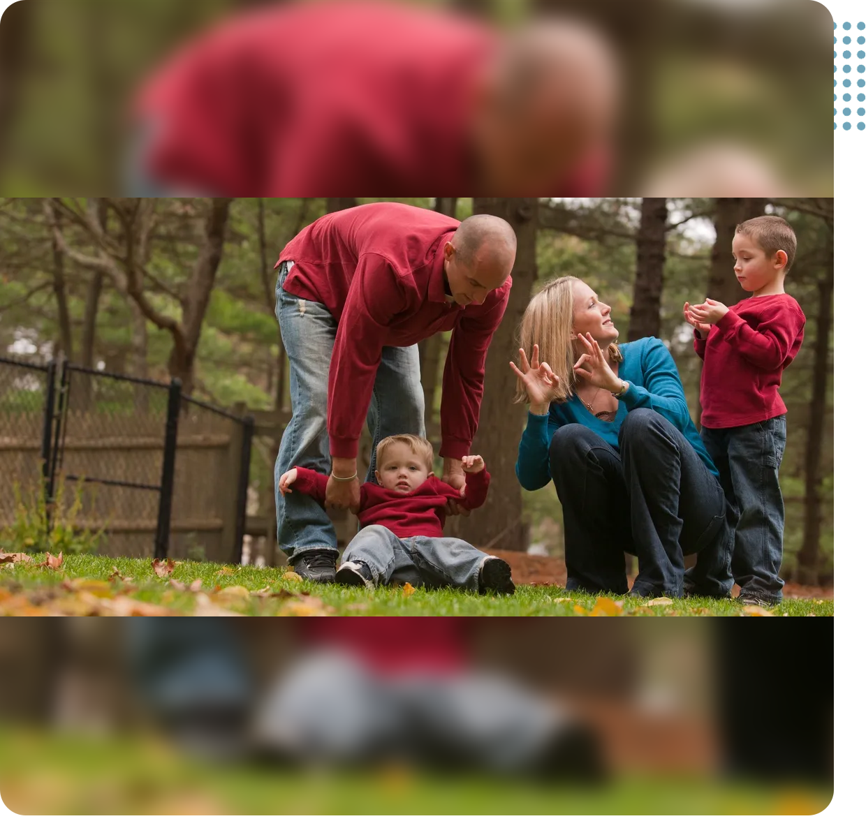 A man and woman playing with their child.
