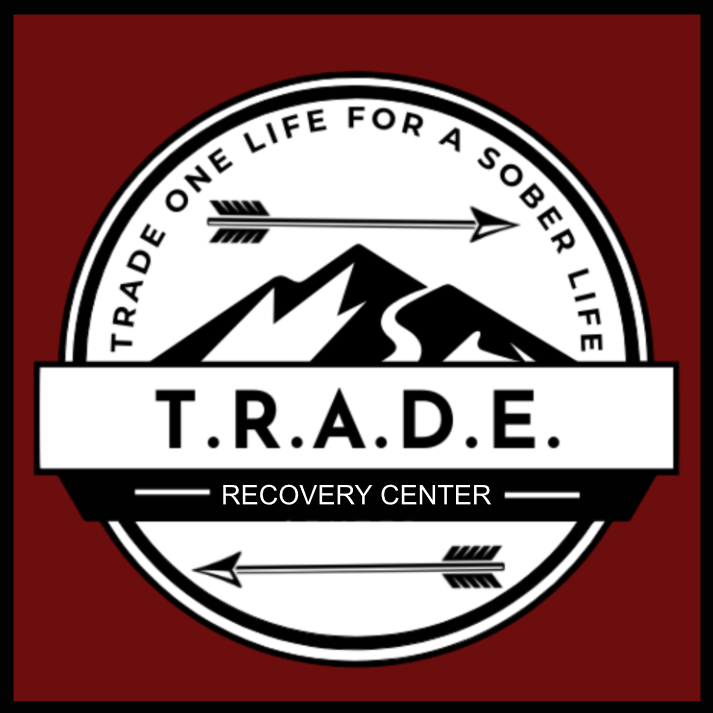 A red and white logo for the t. R. A. D. E recovery center