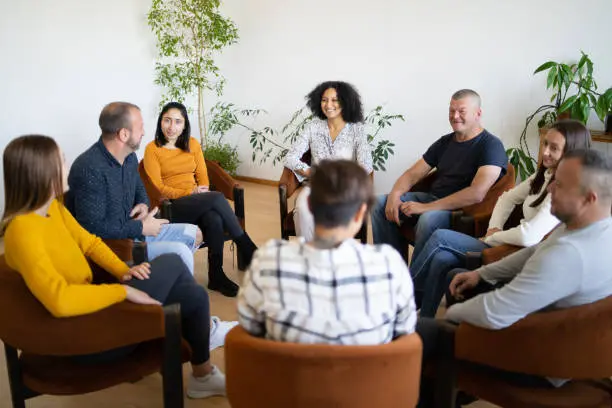 Support group meeting in relaxed circle